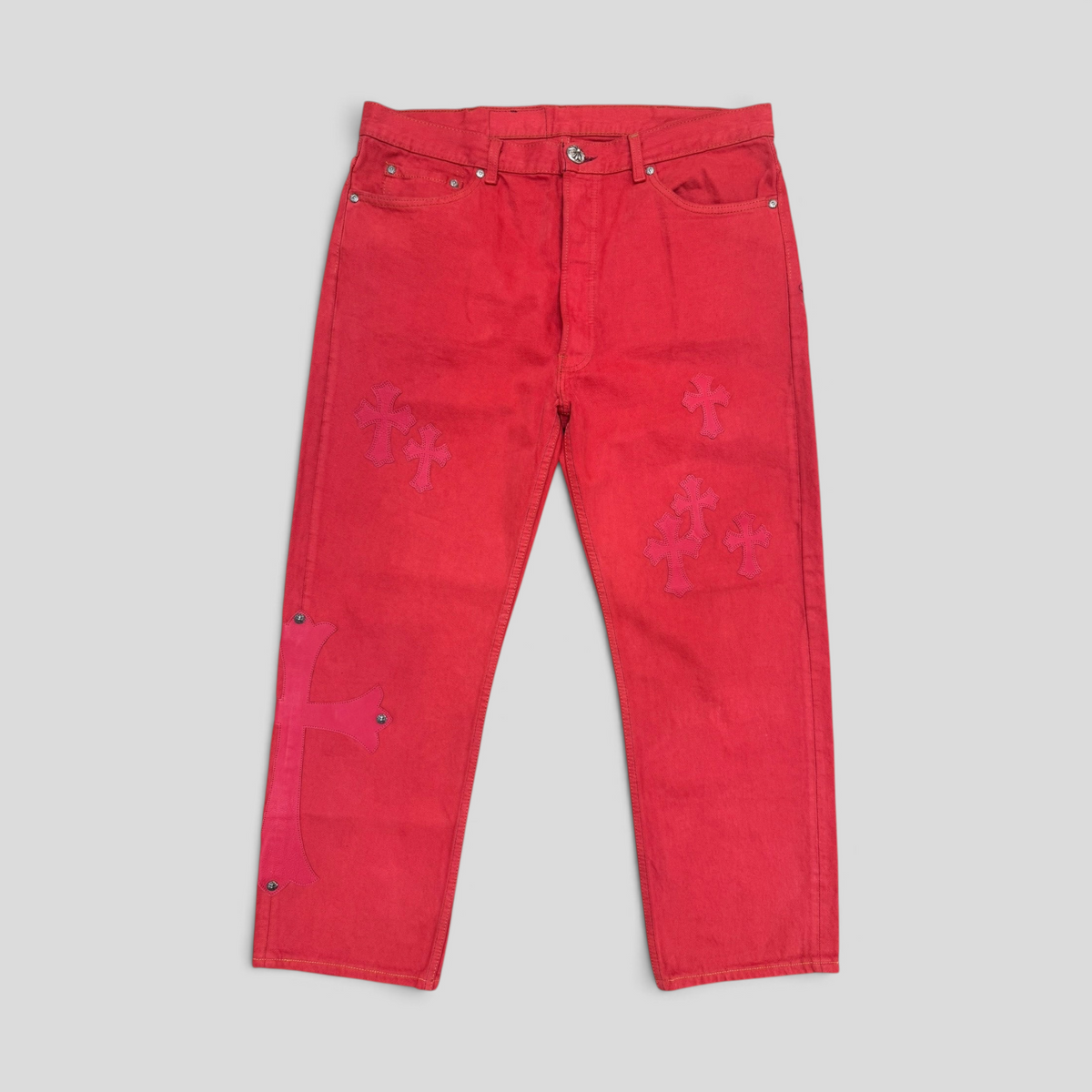 CLB XXIII Chrome Hearts red cotton jeans featuring decorative calf leather cross patches on the legs.