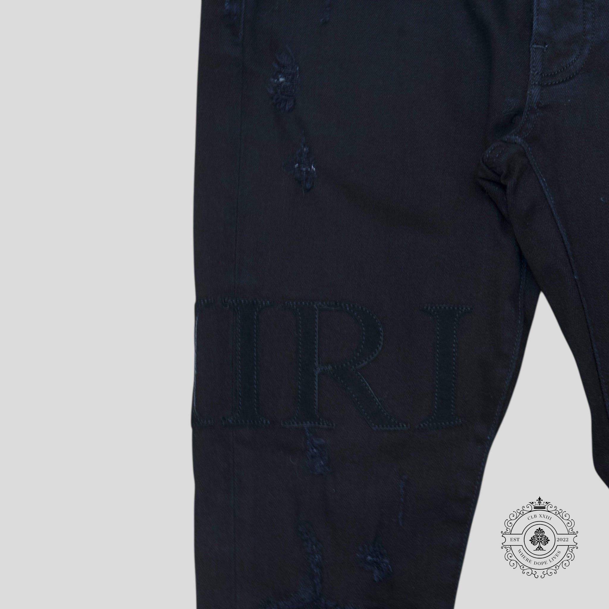 Amiri Serif Logo Jeans in Black