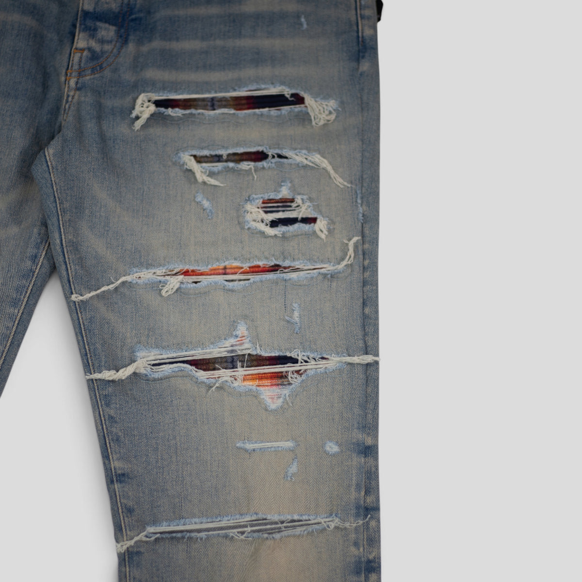 AMIRI PLAID THRASHER JEANS - CLAY INDIGO