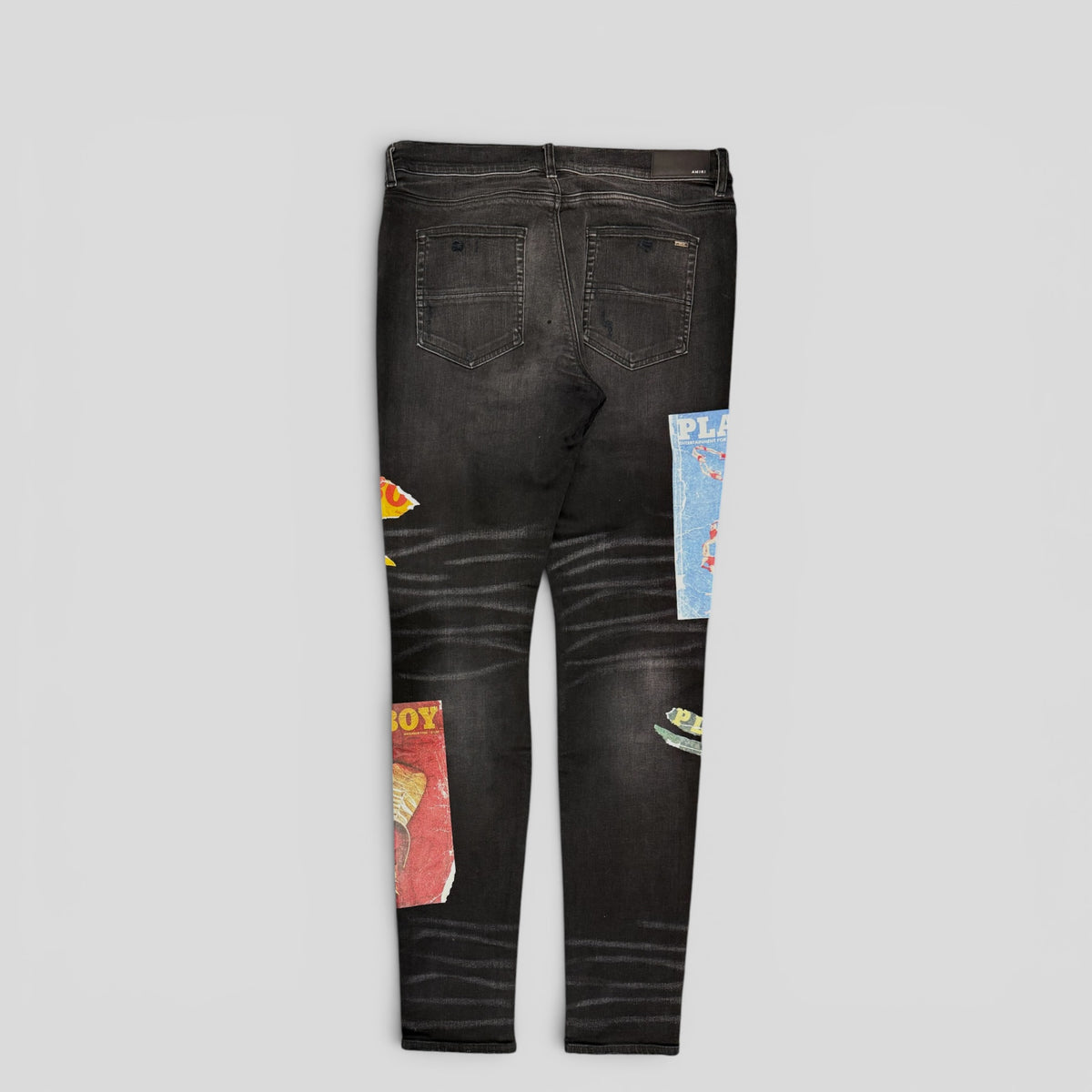 Amiri Playboy Magazine Skinny Jeans in Aged Black