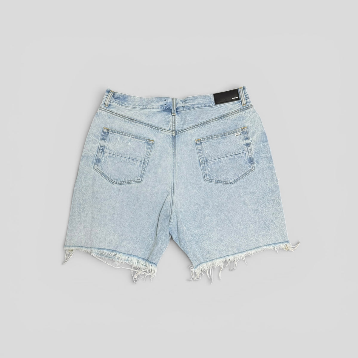 Amiri Tie Dye Thrasher Jean Shorts in Light Wash