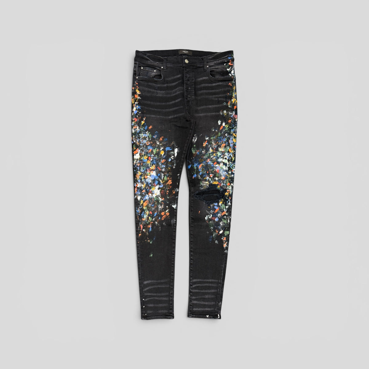 Amiri Distressed Paint Splatter Jeans in Aged Black
