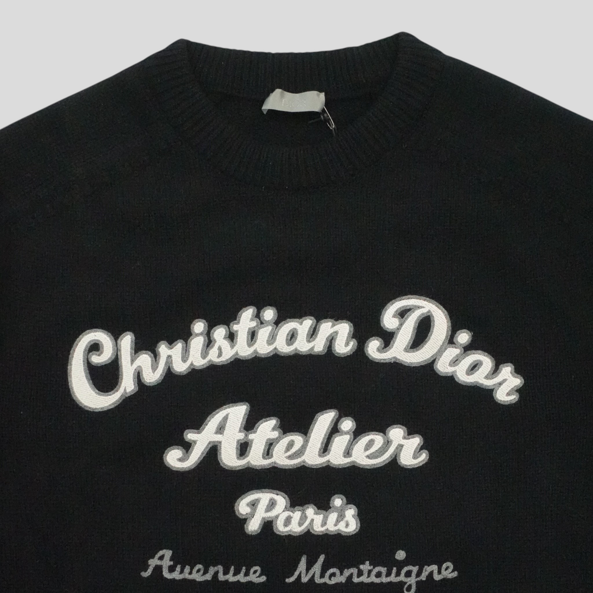 CLB XXIII black virgin wool sweater featuring white Christian Dior Atelier embroidery on the chest