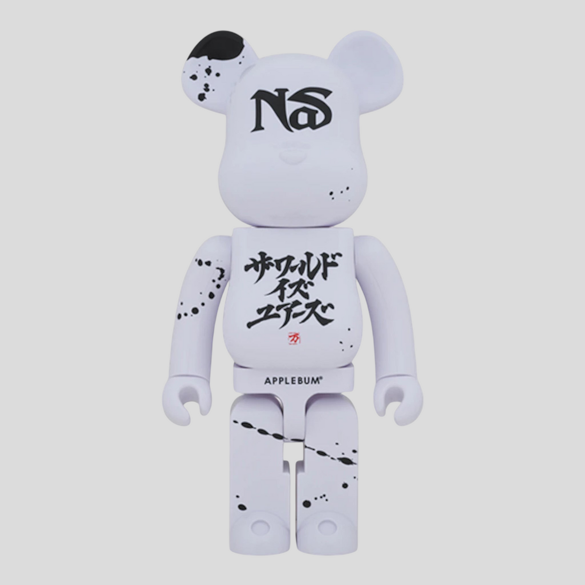 CLB XXIII 1000% Bearbrick Nas x Applebum collectible figure in white with black paint splatter and graphic details.