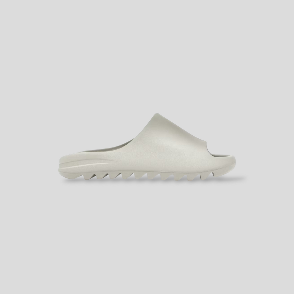 CLB XXIII YZY YS-01 cream molded slide with a minimalist sculptural silhouette and serrated sole