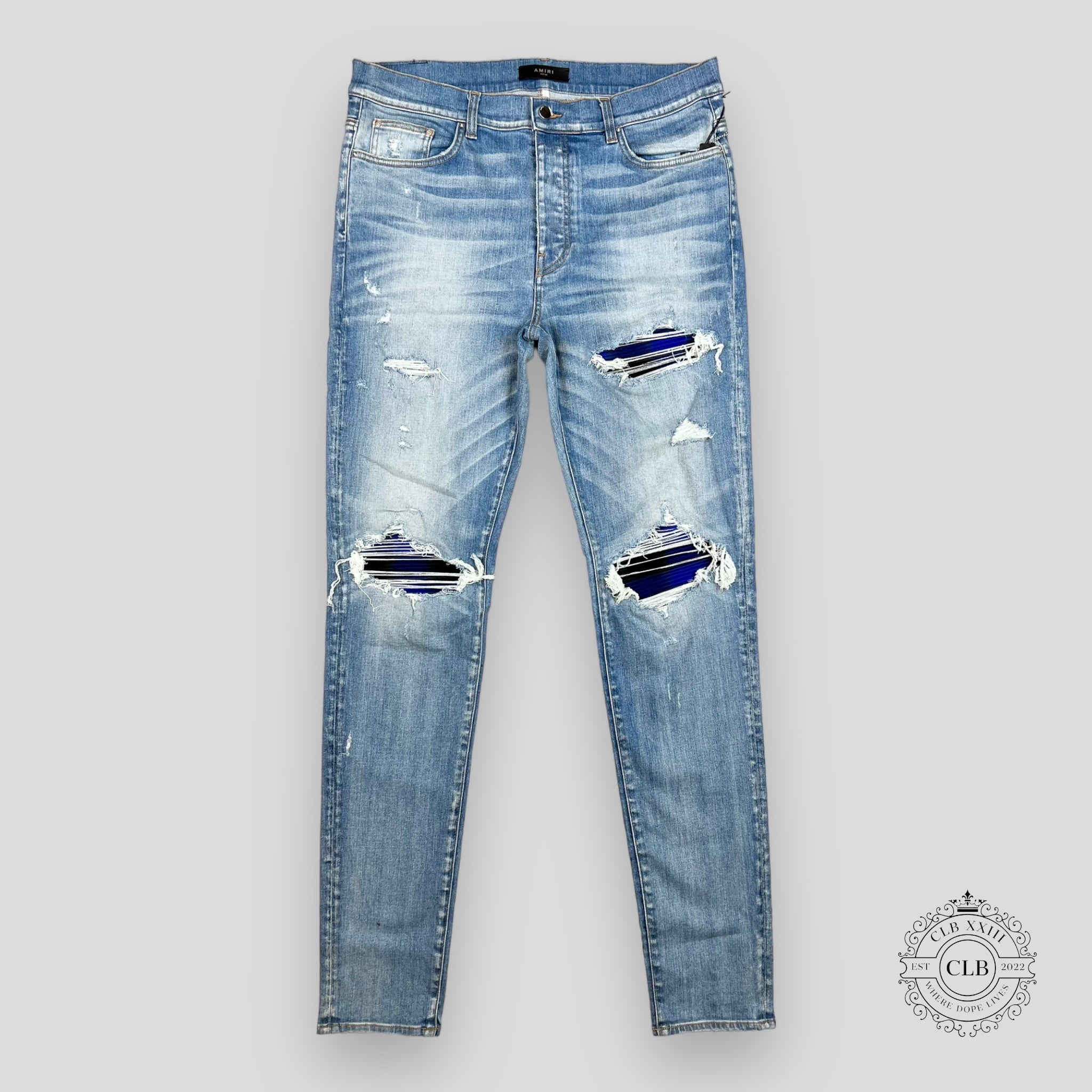 AMIRI PLAID THRASHER JEANS - LIGHT INDIGO