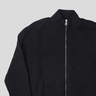 Louis Vuitton Embossed Monogram Tracktop in Black