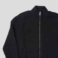 Louis Vuitton Embossed Monogram Tracktop in Black