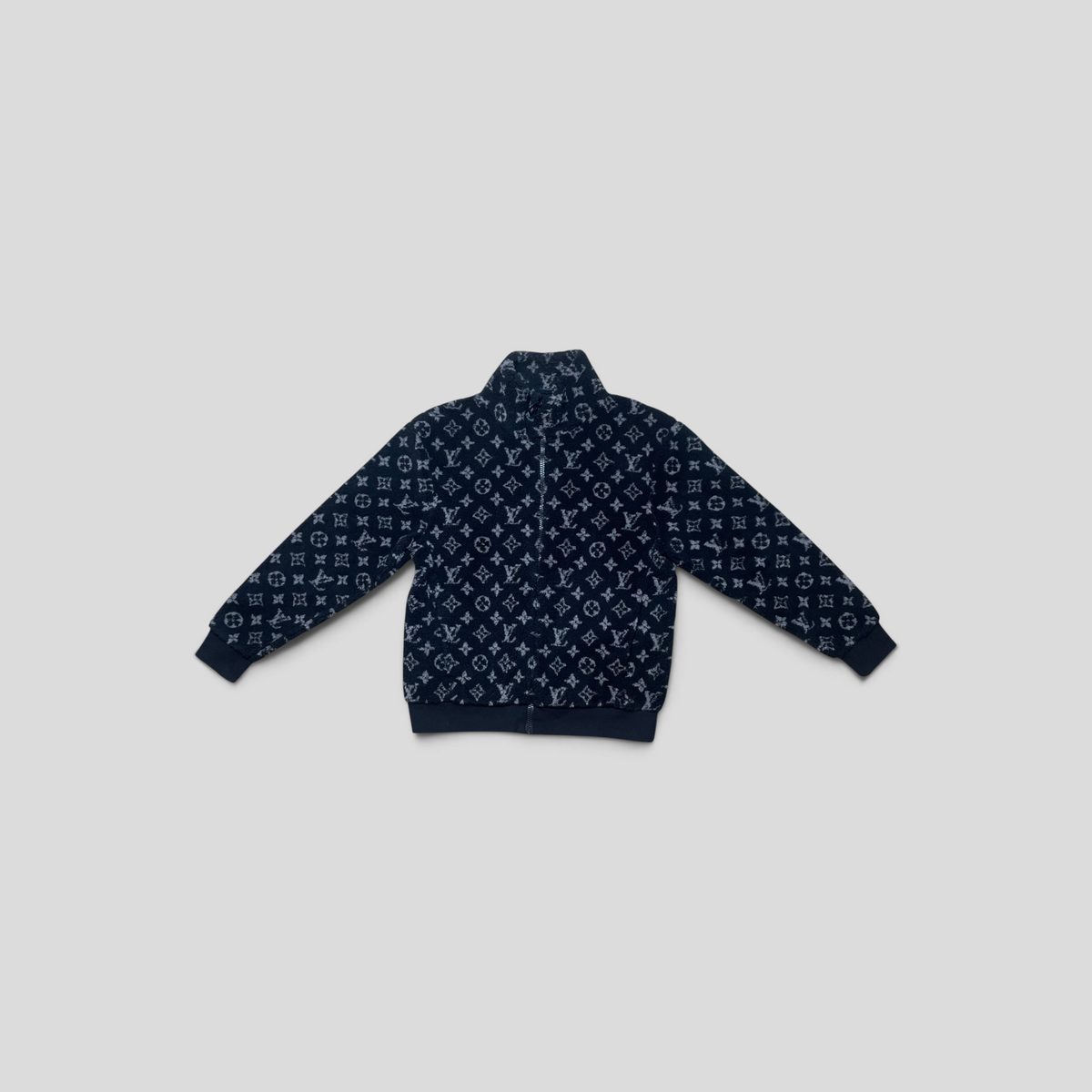 CLB XXIII Louis Vuitton black monogram fleece jacket with zip-up front and ribbed cuffs in gently used condition.