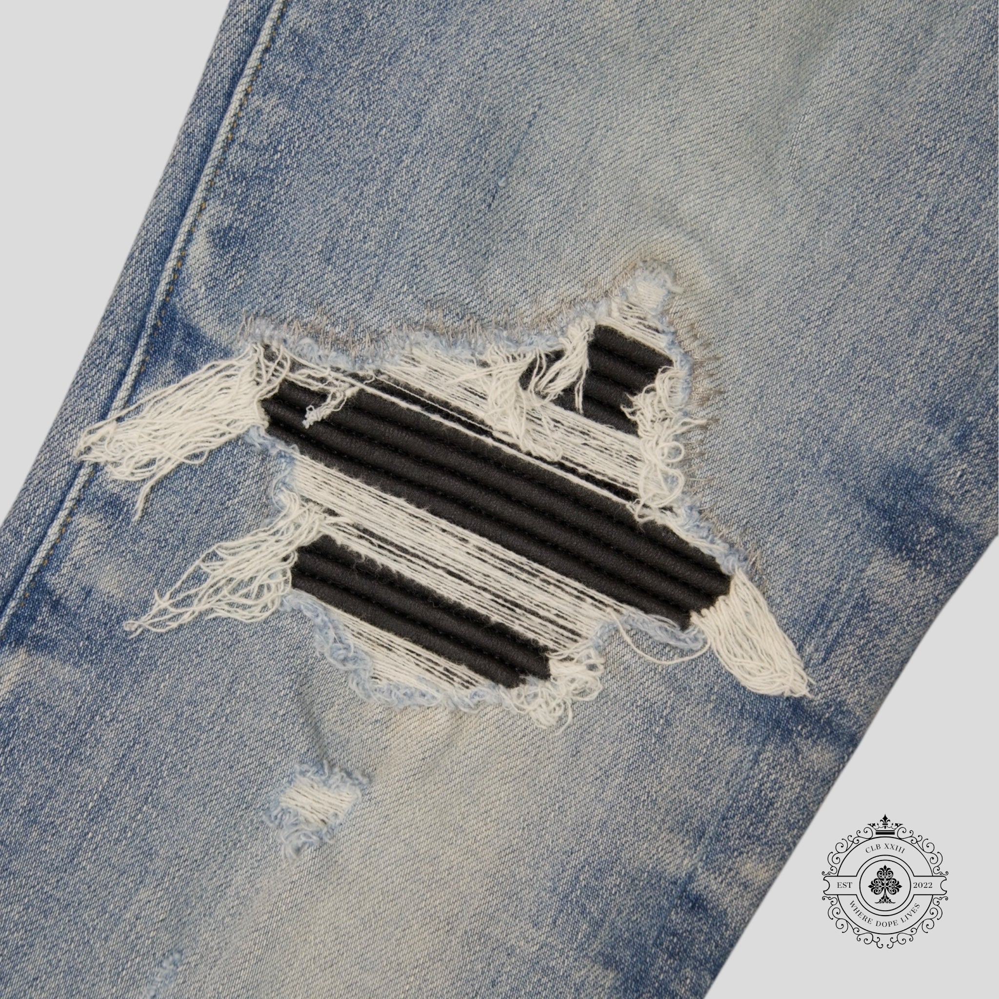 Amiri MX1 Leather Patch Jeans in Light Indigo