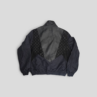 CLB XXIII Louis Vuitton black track top featuring lamb leather and monogram polyamide panels in a back view
