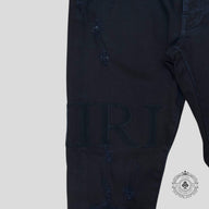 Amiri Serif Logo Jeans in Black