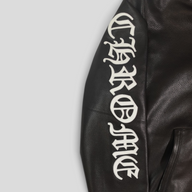 CLB XXIII black leather hoodie sleeve with white gothic Chrome Hearts lettering detail