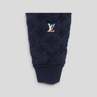 CLB XXIII navy blue Louis Vuitton bomber jacket sleeve with embossed monogram pattern and rainbow LV logo patch
