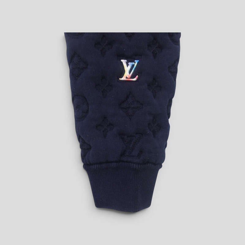 CLB XXIII navy blue Louis Vuitton bomber jacket sleeve with embossed monogram pattern and rainbow LV logo patch
