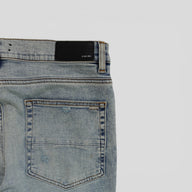 Amiri Pajama Art Patch Jeans in Light Vintage