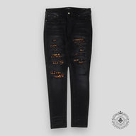Amiri Leopard Patch Thrasher Jeans in Black