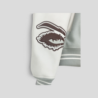 CLB XXIII Louis Vuitton Studios varsity jacket sleeve in blue wool and white calfskin with eye patch detail