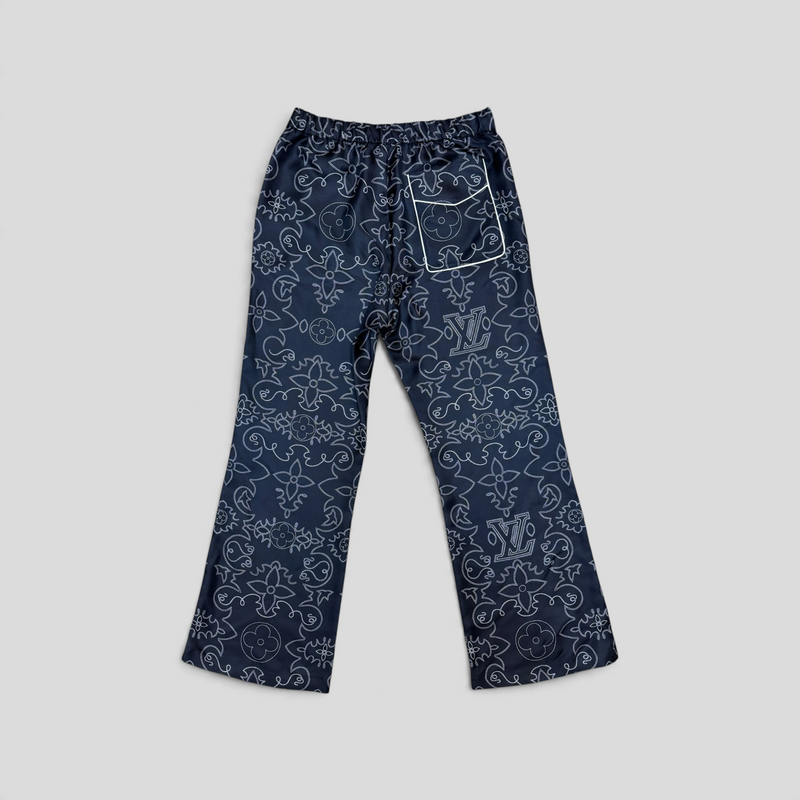 CLB XXIII Louis Vuitton navy blue silk pajama pants with white monogram floral print and back pocket detail.