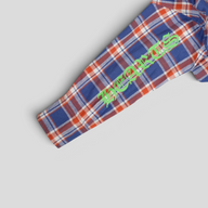 CLB XXIII blue and red plaid cotton flannel shirt featuring a green graphic logo on the sleeve