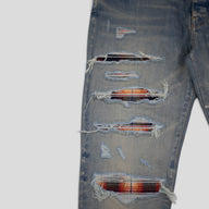 AMIRI PLAID THRASHER JEANS - CLAY INDIGO