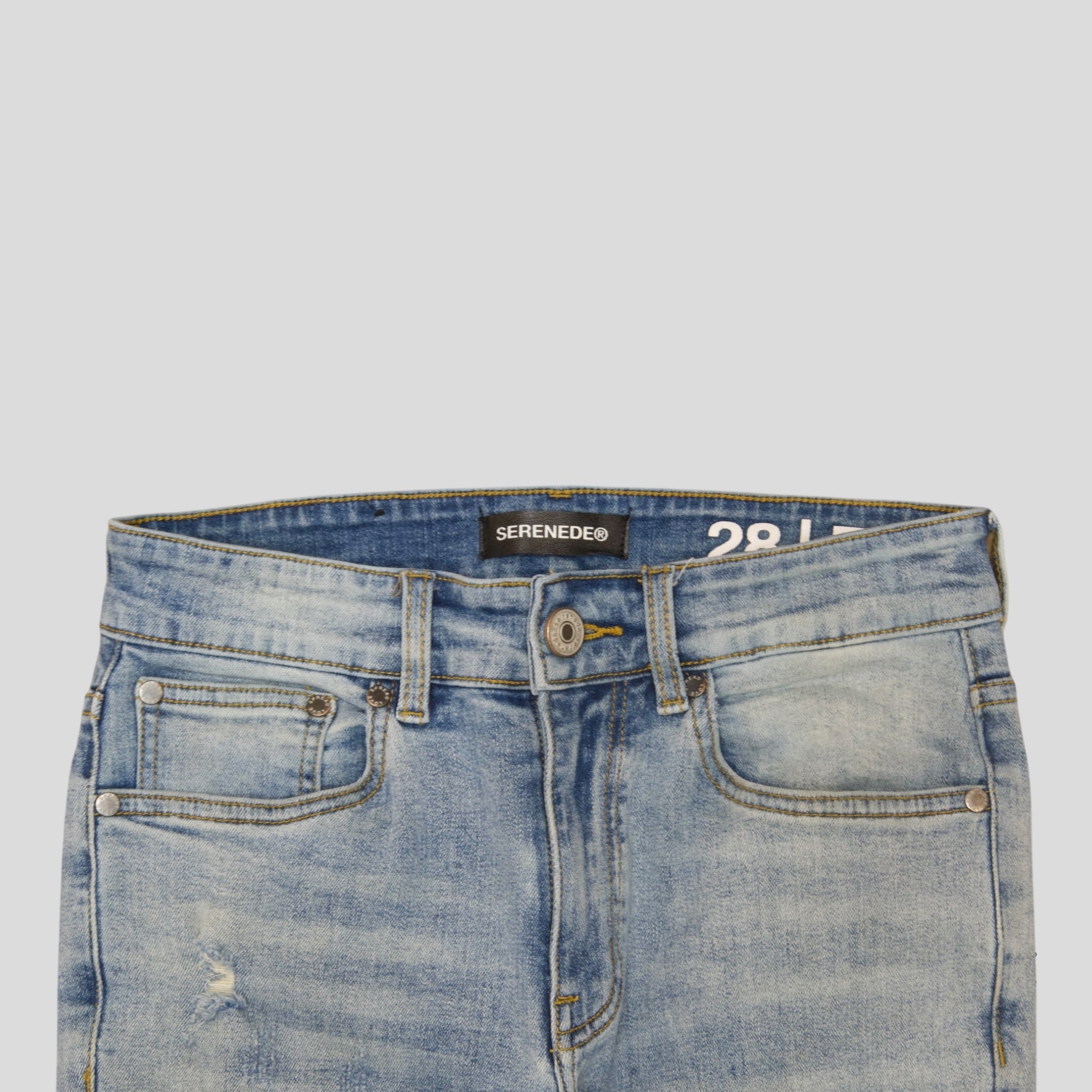 Serenede Distressed Fitted Denim Jeans	in Light Wash