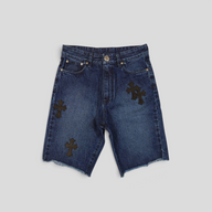 CLB XXIII Chrome Hearts dark wash denim shorts with black leather cross patches and raw hem detail