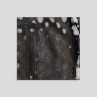 CLB XXIII black leather bomber jacket featuring an embossed Gucci GG monogram pattern.