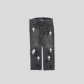 CLB XXIII black denim jeans featuring white and black fleur cross patches on the knees and legs