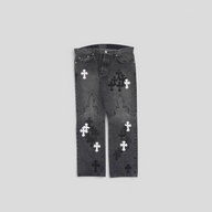 CLB XXIII black denim jeans featuring white and black fleur cross patches on the knees and legs