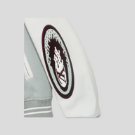 CLB XXIII Louis Vuitton Studios varsity jacket sleeve detail featuring a white calfskin leather sleeve and logo patch