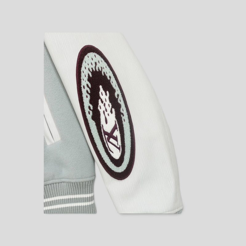 CLB XXIII Louis Vuitton Studios varsity jacket sleeve detail featuring a white calfskin leather sleeve and logo patch