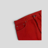 CLB XXIII red cotton jeans featuring silver hardware and button fly detail