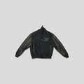 CLB XXIII Louis Vuitton black varsity jacket featuring calfskin leather sleeves with monogram and wool body
