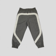 CLB XXIII grey wool track pants featuring a white checkered pattern trim and elasticated cuffs.