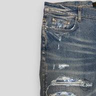 Amiri Tie Dye Bandana Thrasher Jeans in Clay Indigo