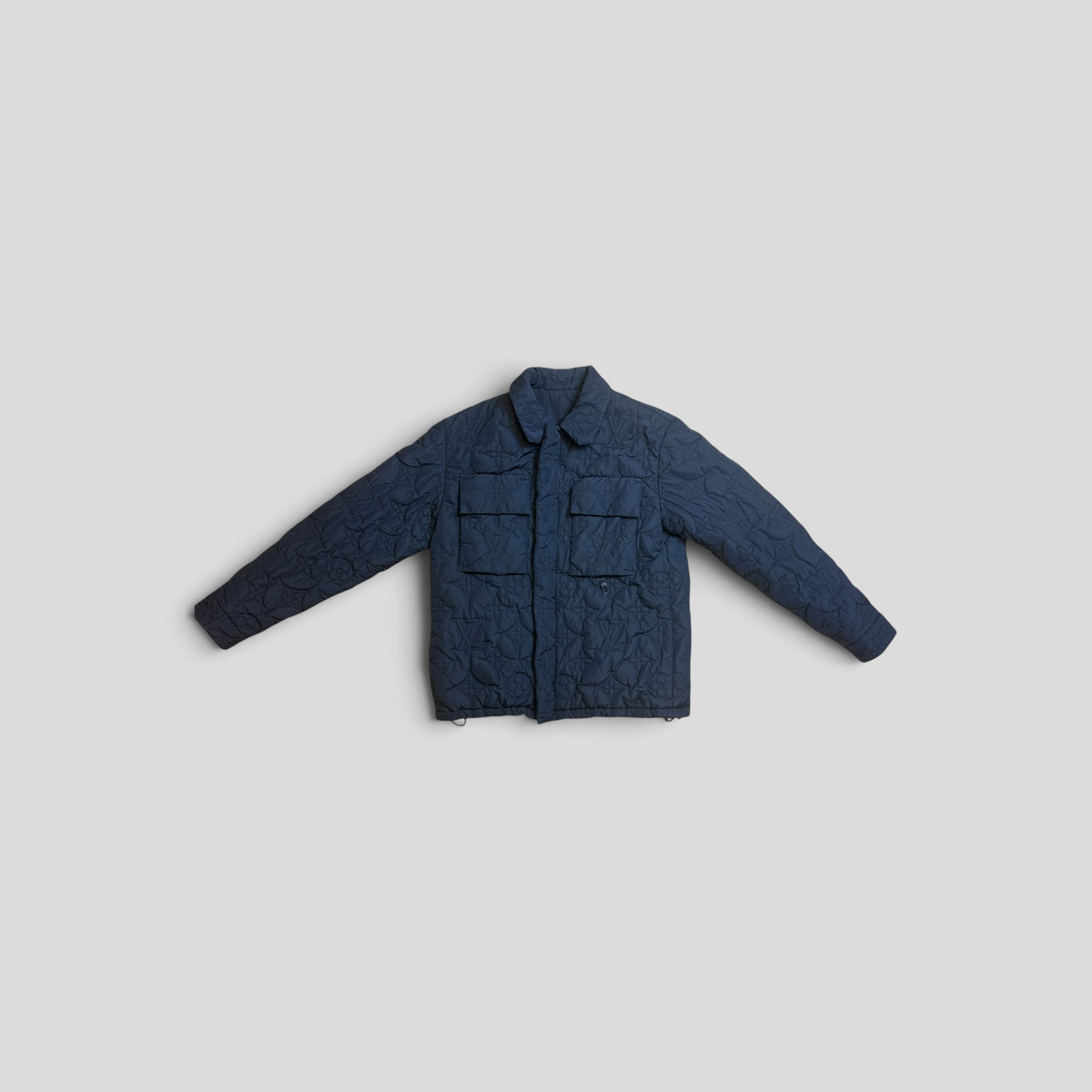 CLB XXIII navy blue Louis Vuitton monogram embossed padded jacket with two front chest pockets and a collared design.