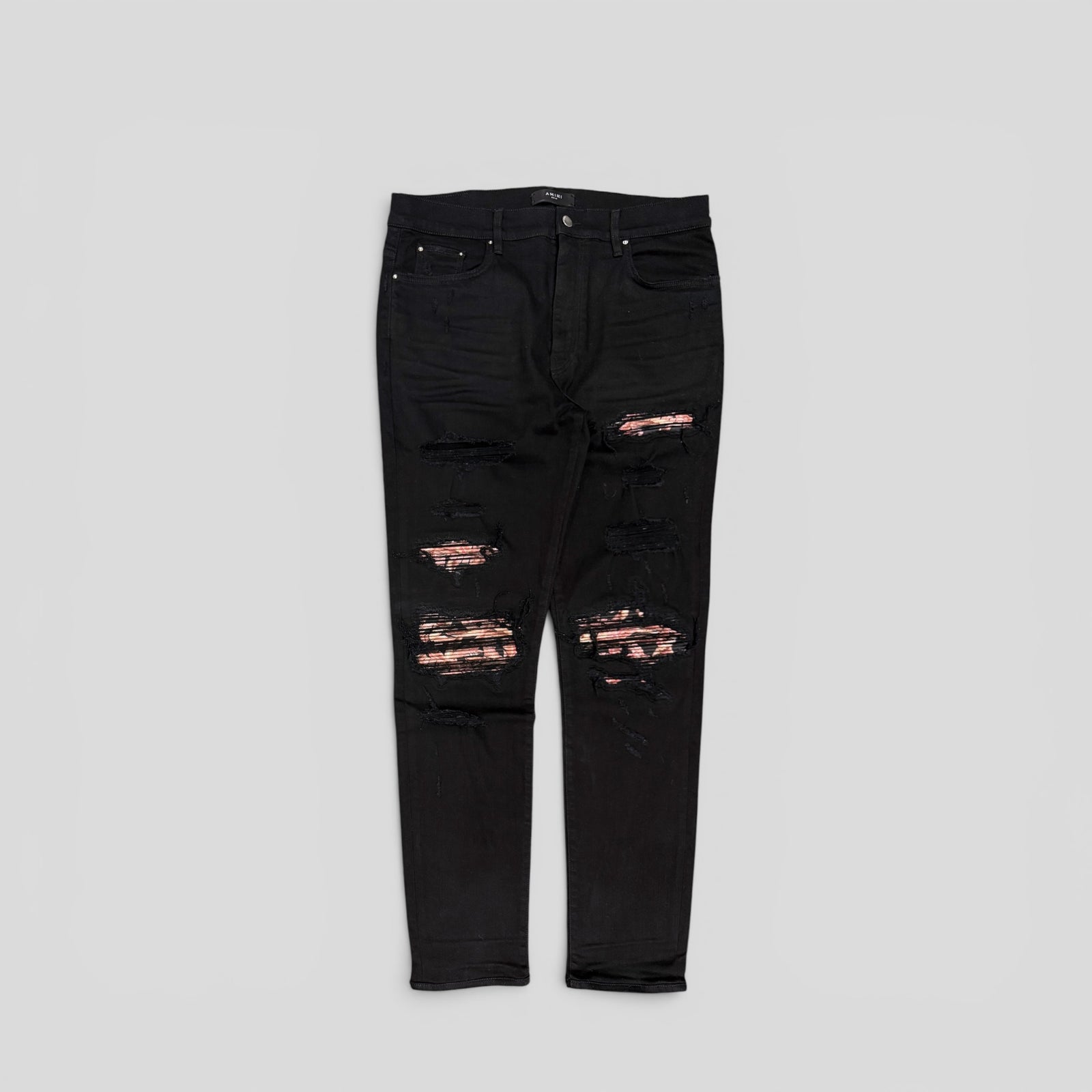 Amiri Banana Leaf Patch Thrasher Jeans in Black