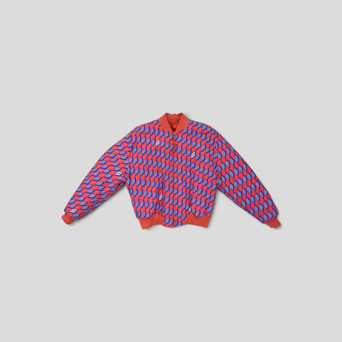 CLB XXIII Louis Vuitton orange bomber jacket featuring a blue and white Diamond Damier graphic on polyamide fabric.