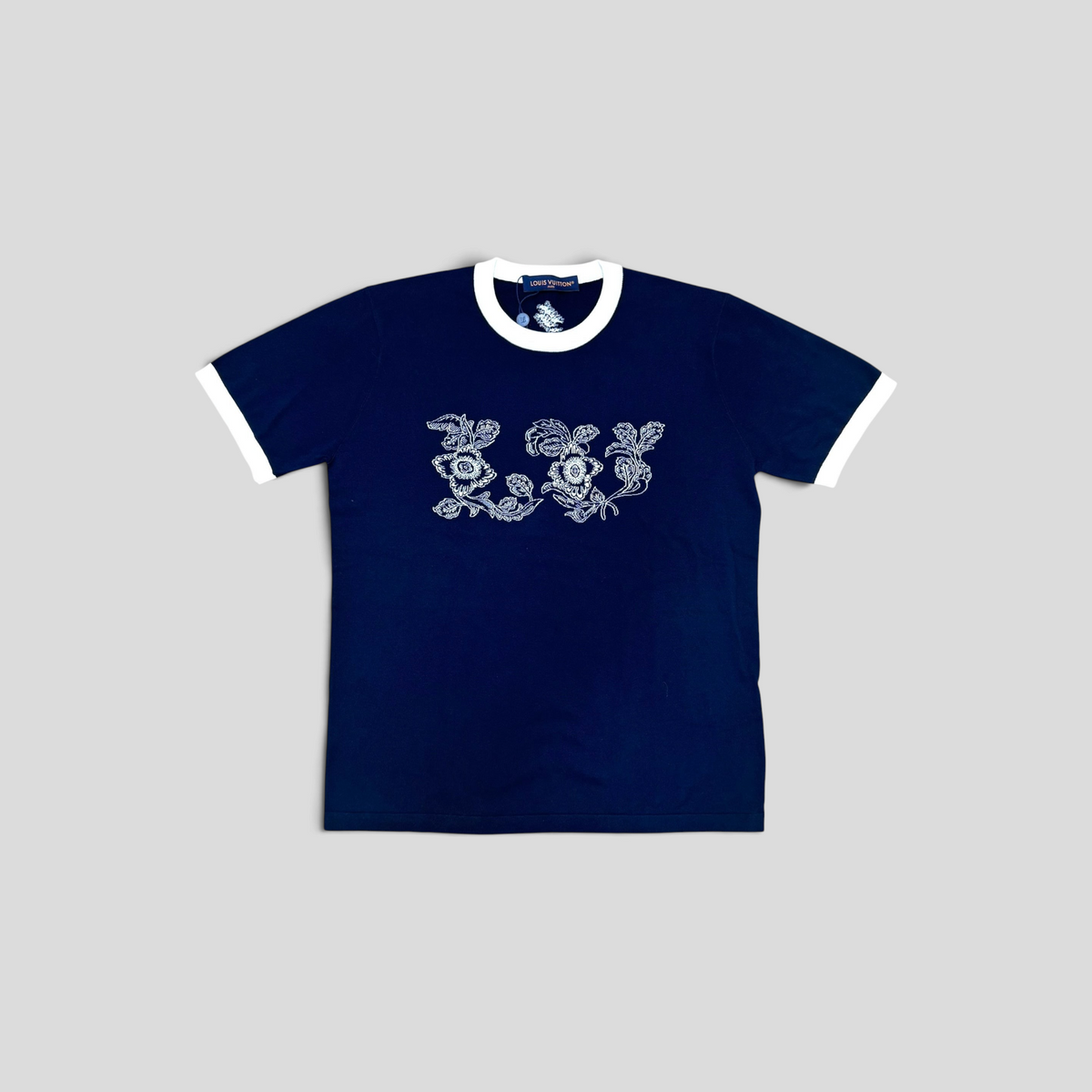CLB XXIII Louis Vuitton navy blue short sleeve crewneck t-shirt with white floral intarsia graphic and trim