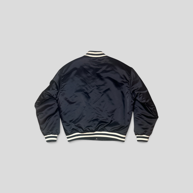 Back view of a black Louis Vuitton LV Lovers baseball bomber jacket by CLB XXIII featuring striped ribbed trim.