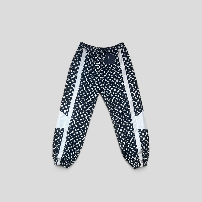 CLB XXIII Louis Vuitton black and white monogram printed polyamide technical trackpants with side stripe detail.