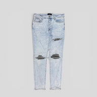 Amiri Leather Patch Thrasher Jeans in Light Wash / Black