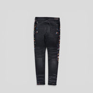 Amiri Distressed Paint Splatter Jeans in Aged Black