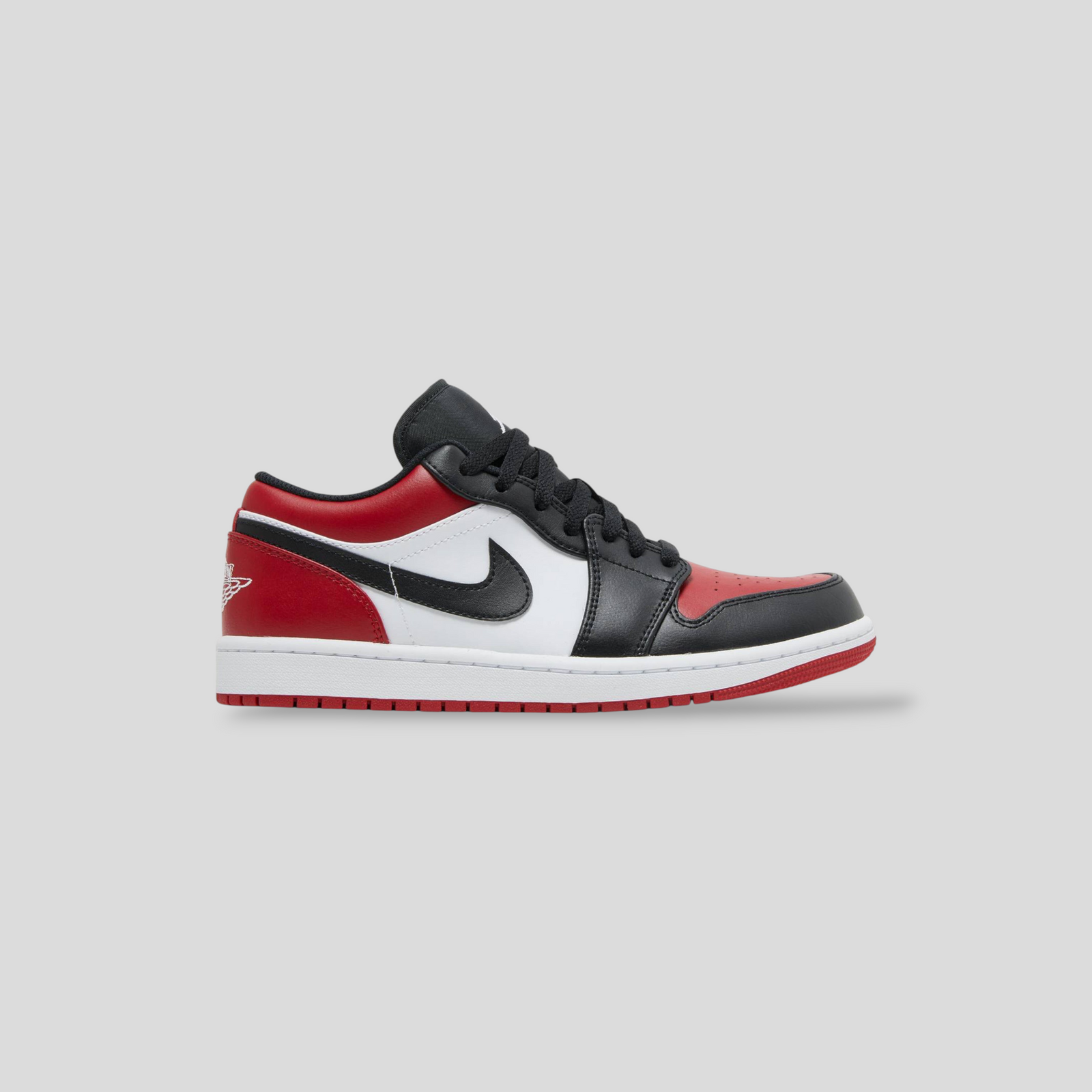 CLB XXIII Air Jordan 1 Low Bred Toe sneaker in black, white, and red leather with iconic Wings logo and rubber sole.