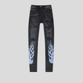 CLB XXIII Amiri black denim jeans featuring distressed details and blue bandana flame print on the lower legs.