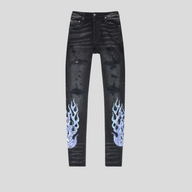 CLB XXIII Amiri black denim jeans featuring distressed details and blue bandana flame print on the lower legs.