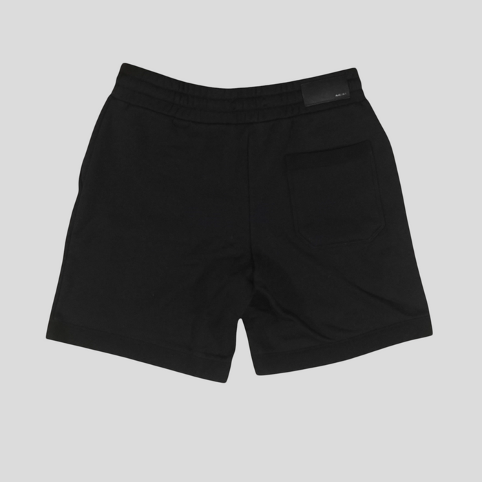 CLB XXIII Amiri black cotton sweatshorts with a back pocket and branded patch, shown from the rear view.