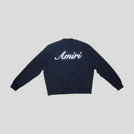 CLB XXIII black Amiri crewneck sweatshirt with white embroidered script logo on the back, made of 100% cotton.