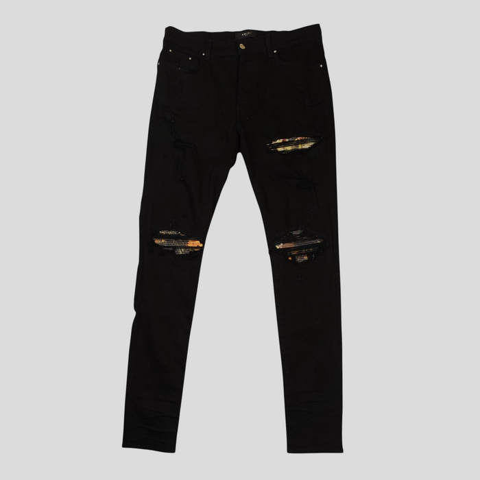 CLB XXIII Amiri black cotton jeans featuring distressed knees with colourful aloha print patches